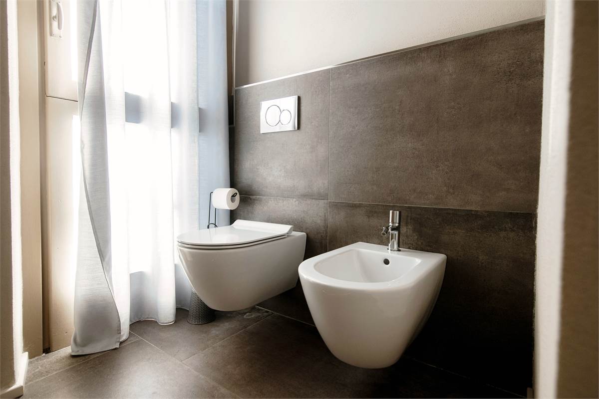 Elegante trilocale finemente ristrutturato ed arredato. 