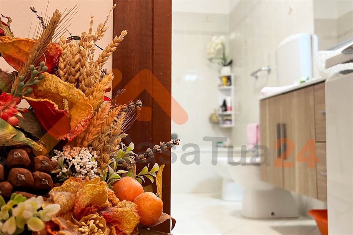 Luminoso bilocale con terrazzino e posto auto coperto