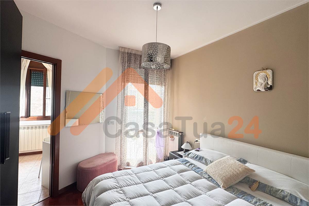 Luminoso bilocale con terrazzino e posto auto coperto