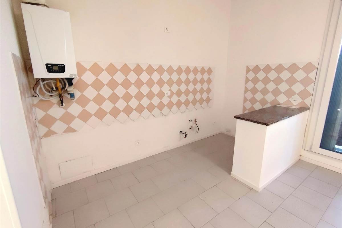 Ampio trilocale con giardino 