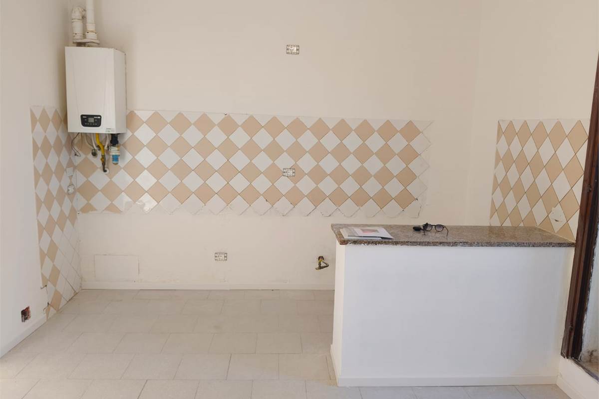 Ampio trilocale con giardino 