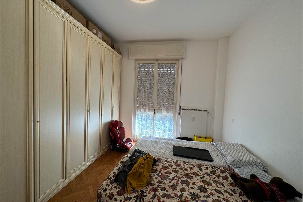 Elegante trilocale con balconi e box