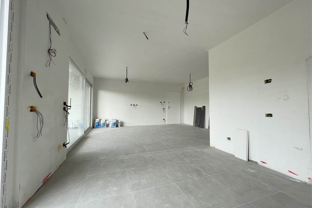 Nuovo trilocale con giardino e box