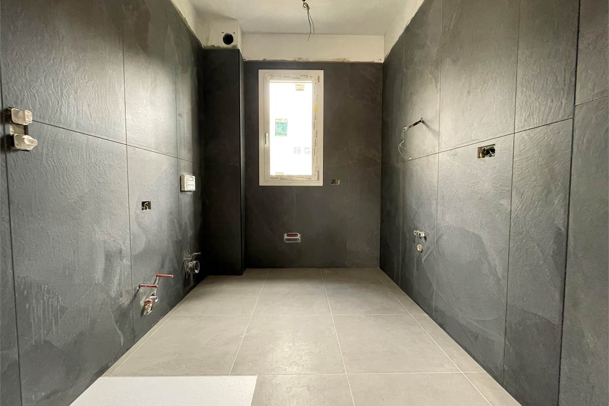 Nuovo trilocale con giardino e box