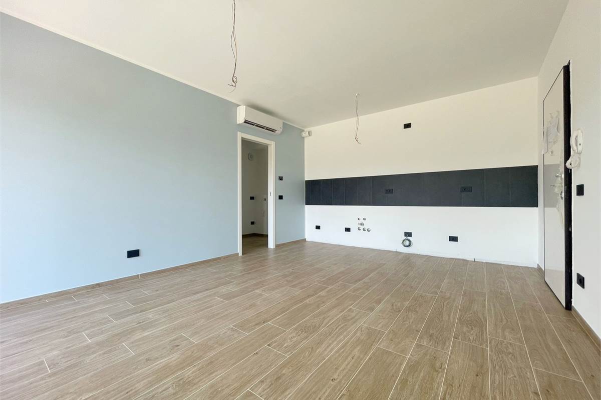 Nuovo bilocale con giardino e box