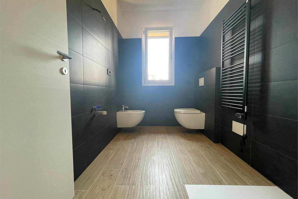 Nuovo bilocale con giardino e box