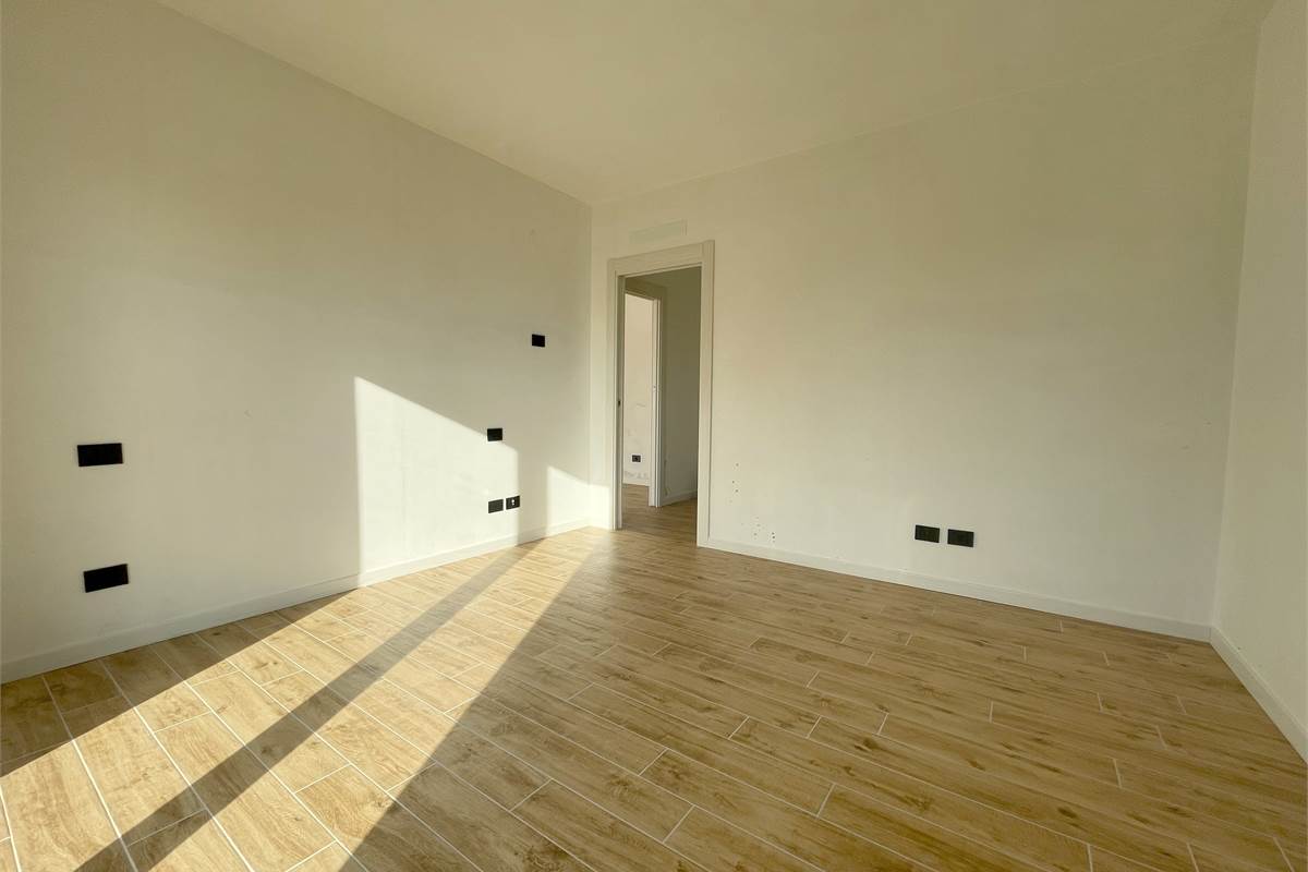 Nuovo bilocale con giardino e box