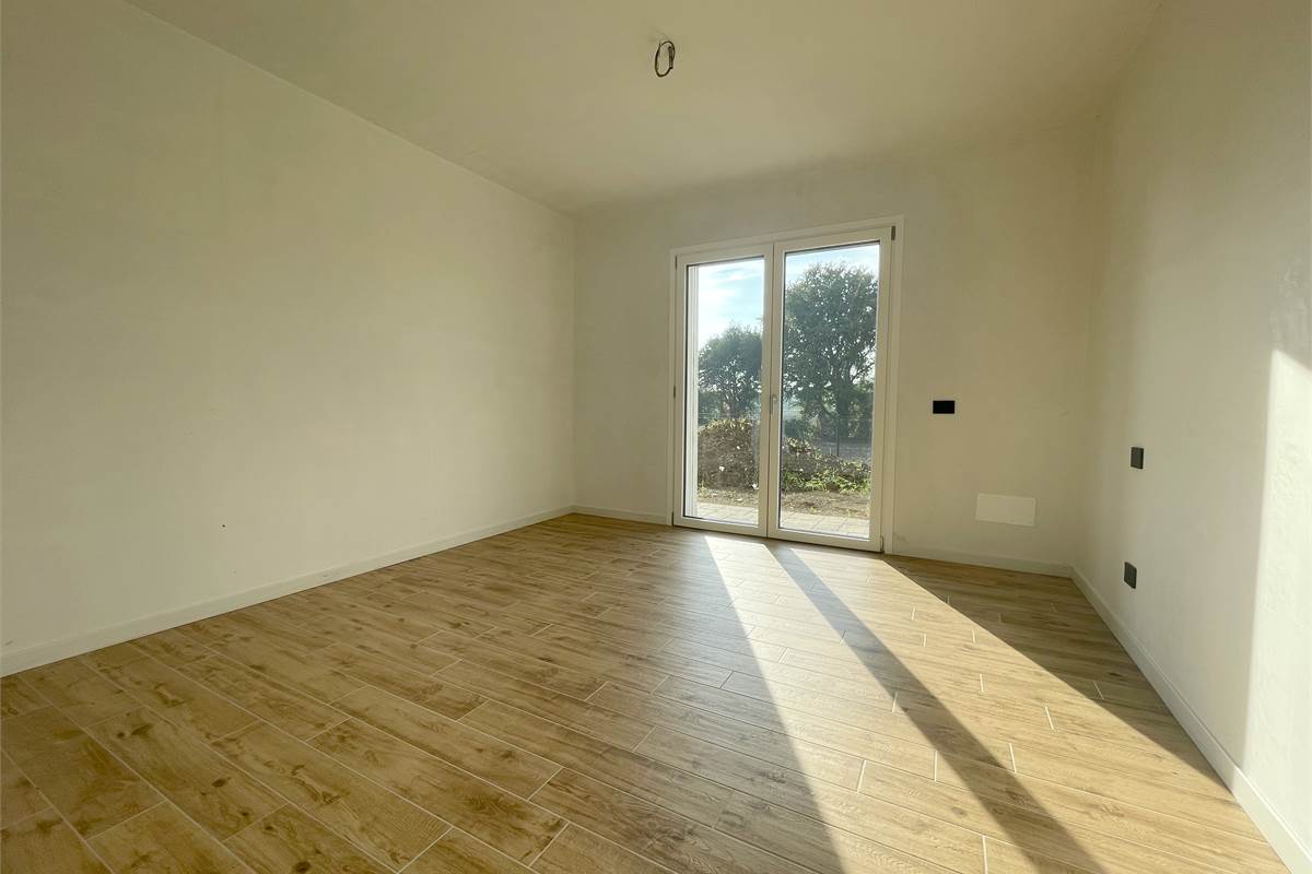 Nuovo bilocale con giardino e box