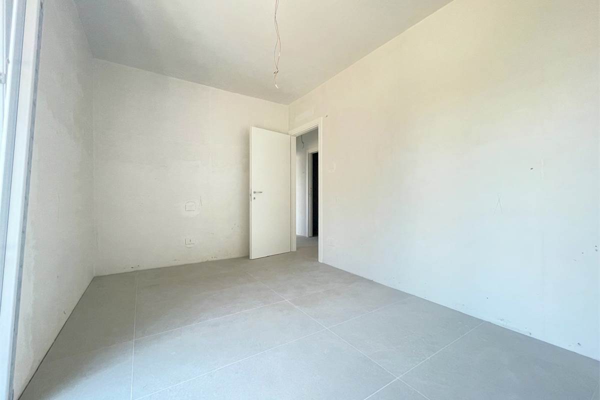 Nuovo trilocale con giardino e box